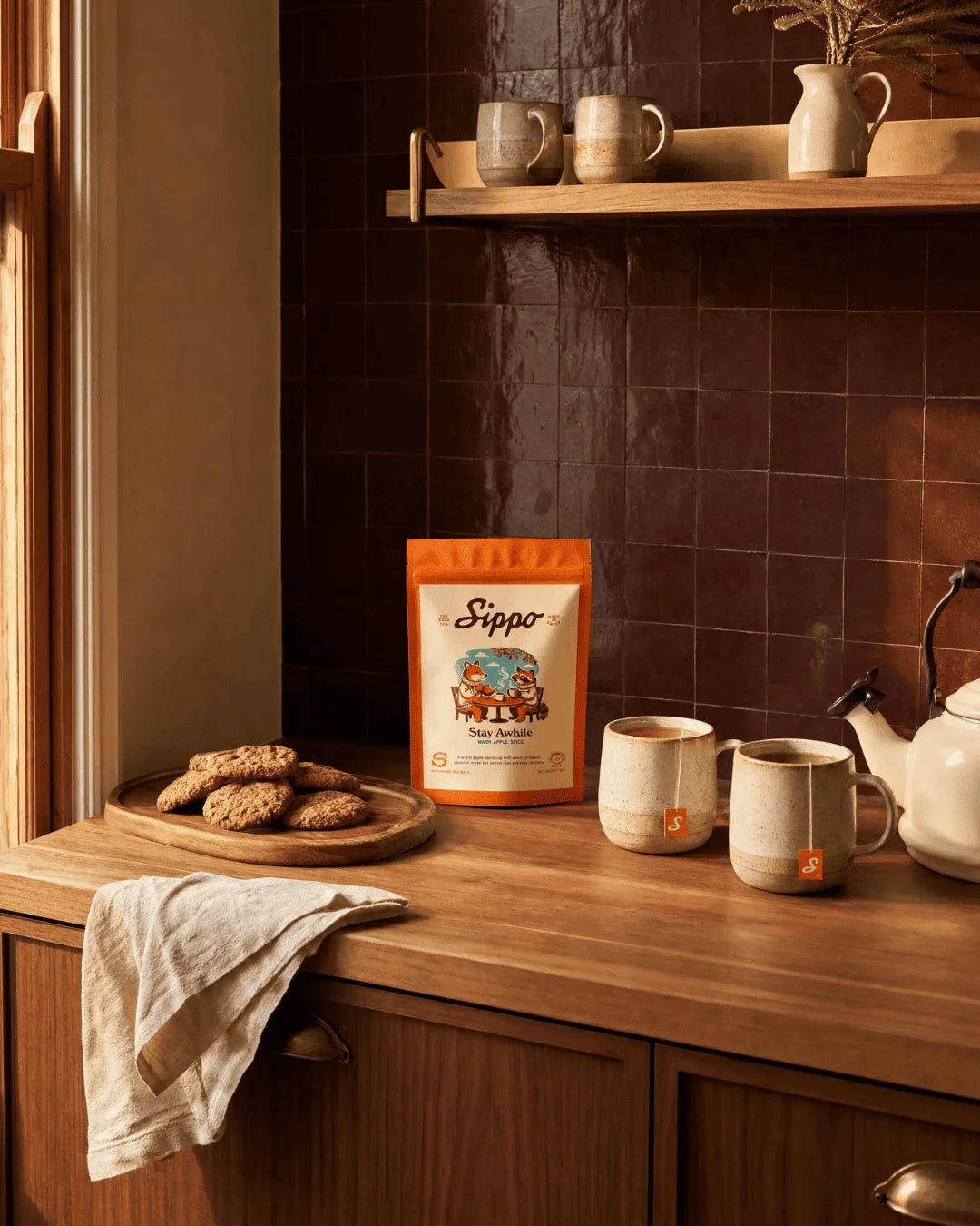 Two mugs of Stay Awhile in the kitchen